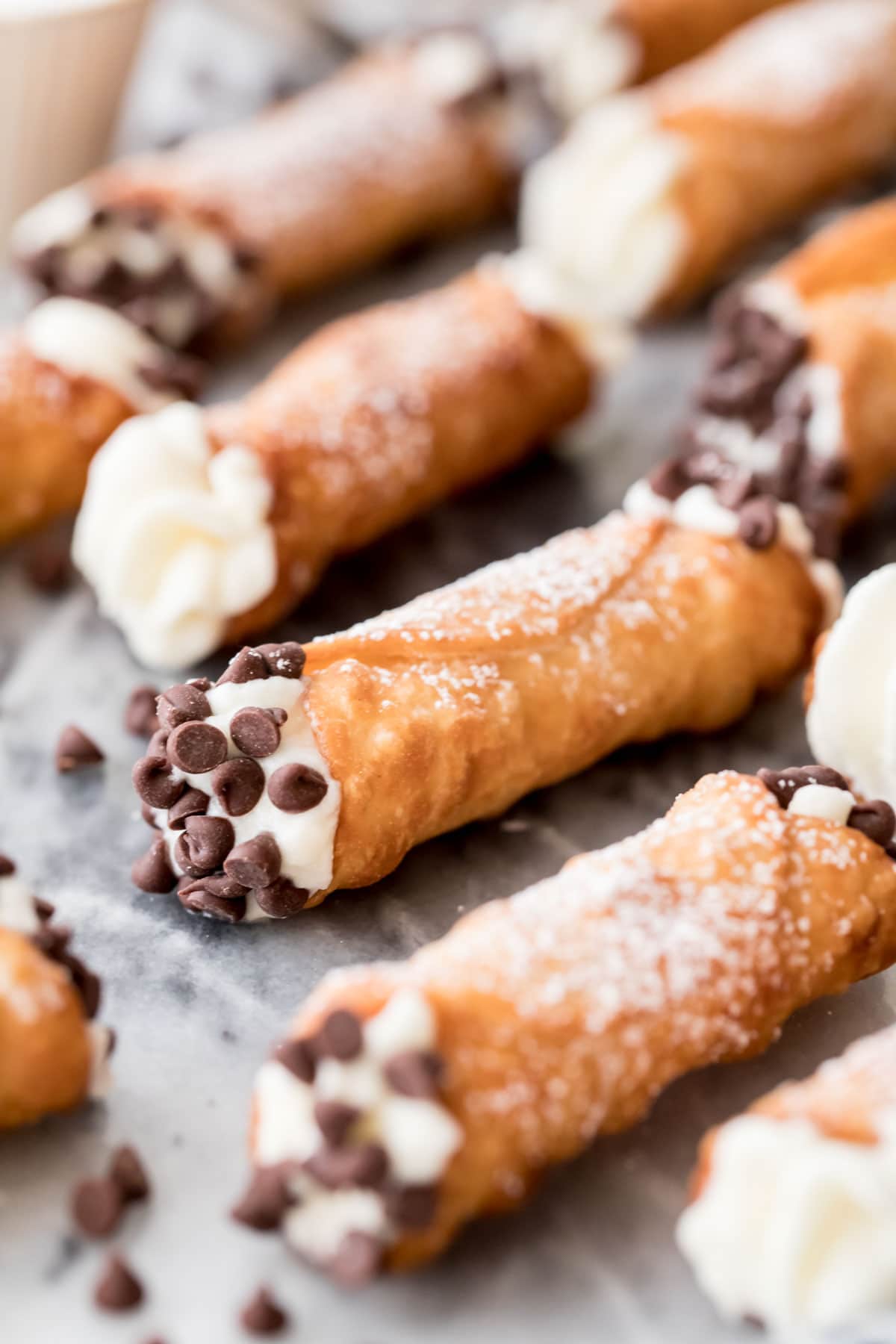 filled cannolis on marble board