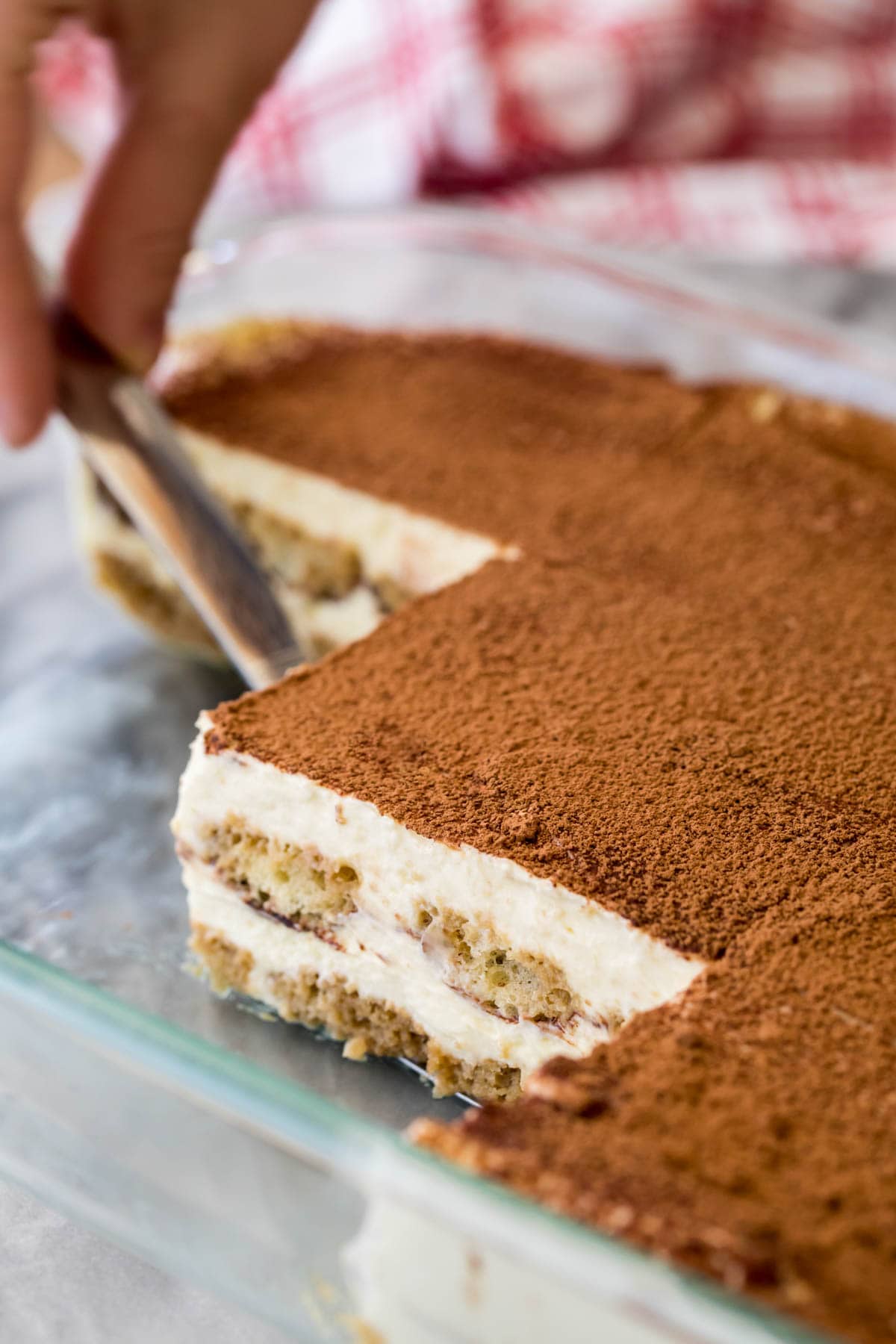 Closeup of tiramisu in glass baking dish