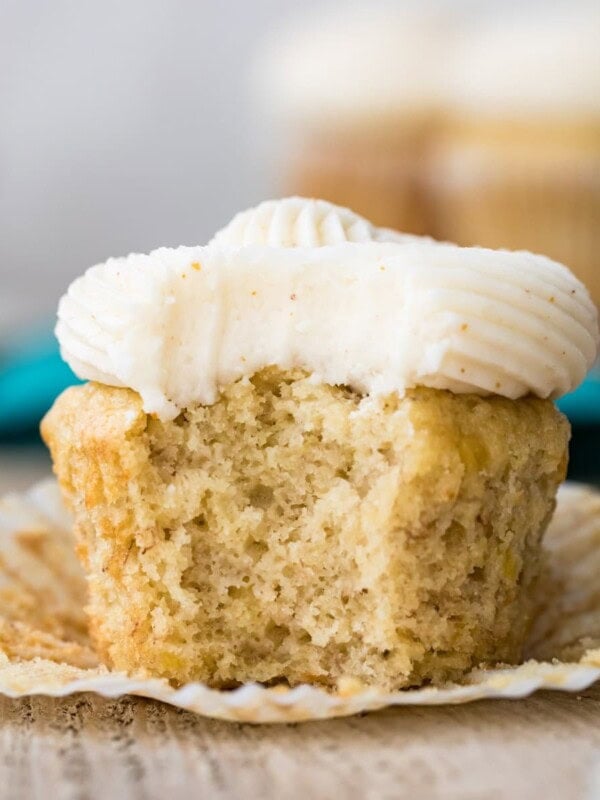 Frosted cupcake with a bite taken out of it.