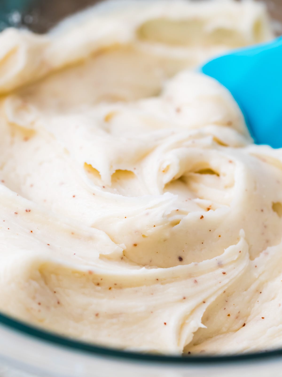 smooth brown butter frosting with flecks of browned butter