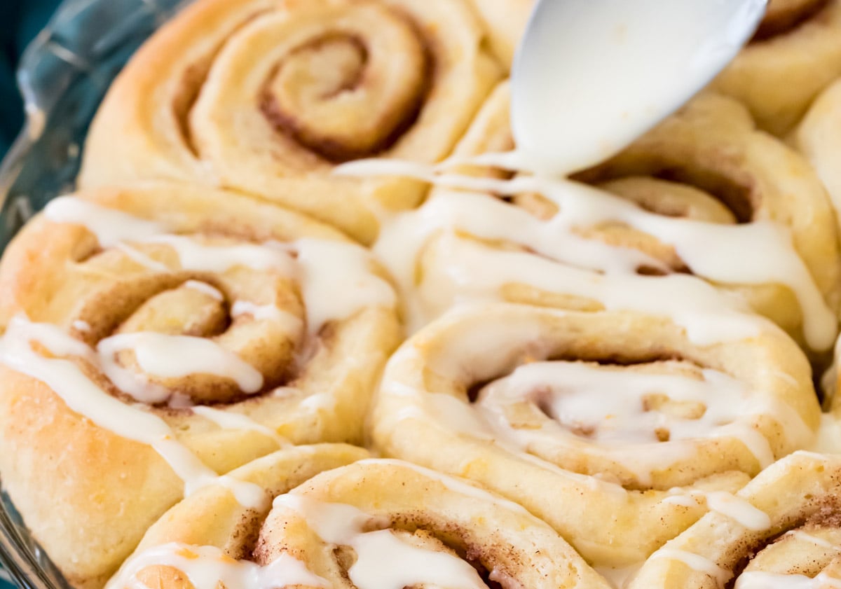 Close up of orange sweet rolls iced