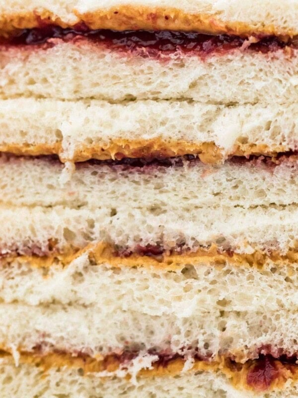 close up of peanut buter and jelly sandwiches cut in half
