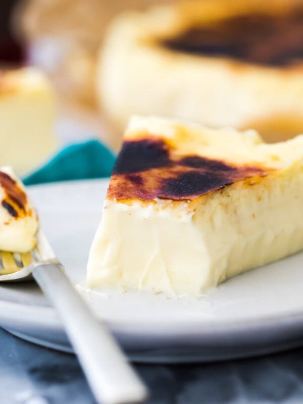 Basque cheesecake with bite taken out on a fork closeup