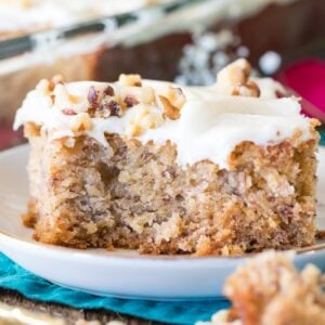 Banana cake with bite taken out on a white plate.