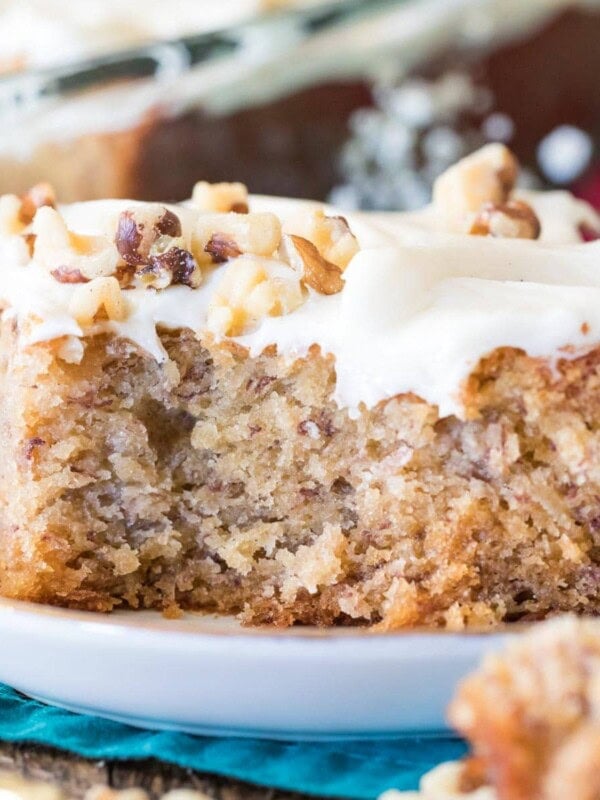 Banana cake with bite taken out on a white plate.