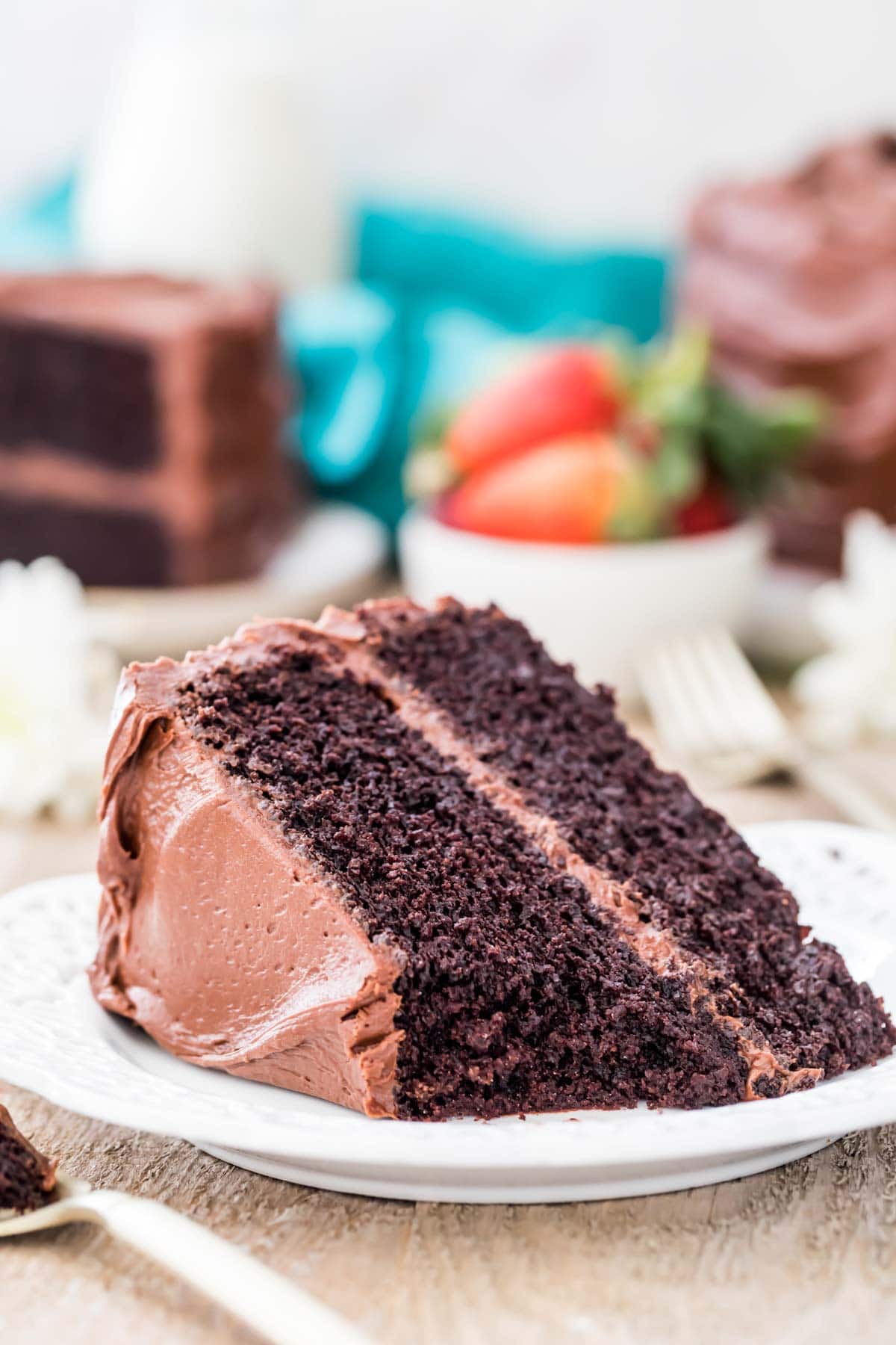 Devil's food cake with a bite taken out on a white plate