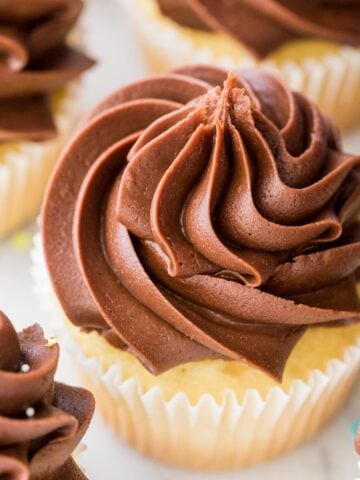 Closeup of chocolate fudge frosting on a cupcake