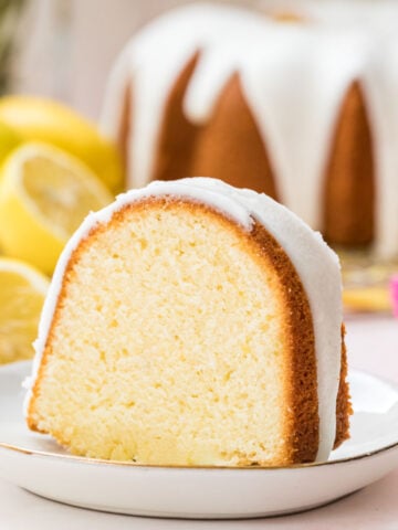 Slice of lemon pound cake on a white plate.