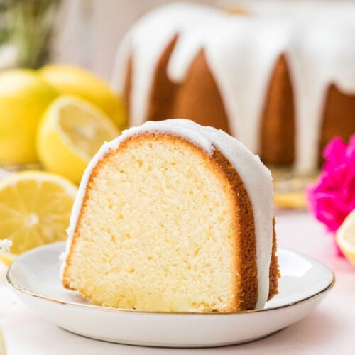 Slice of lemon pound cake on a white plate.