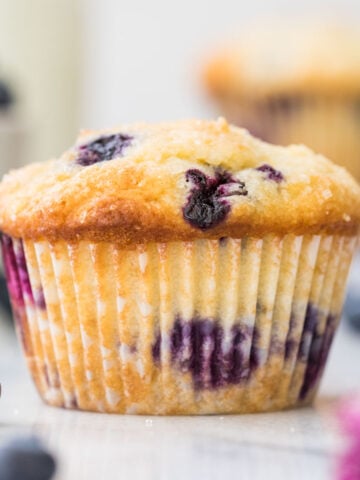 blueberry muffin on white marble