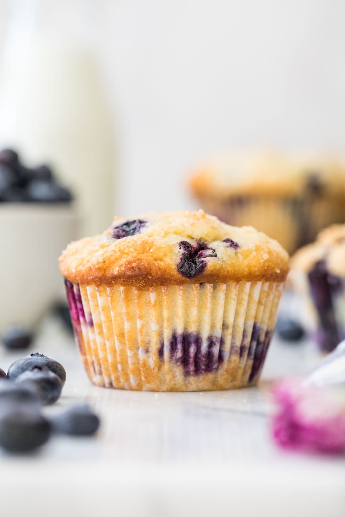 blueberry muffin on white marble