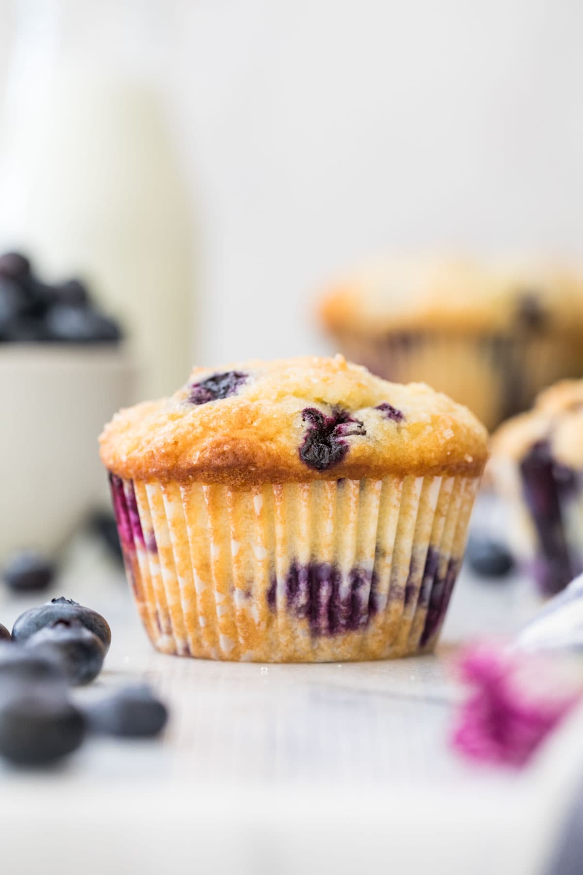 blueberry muffin on white marble