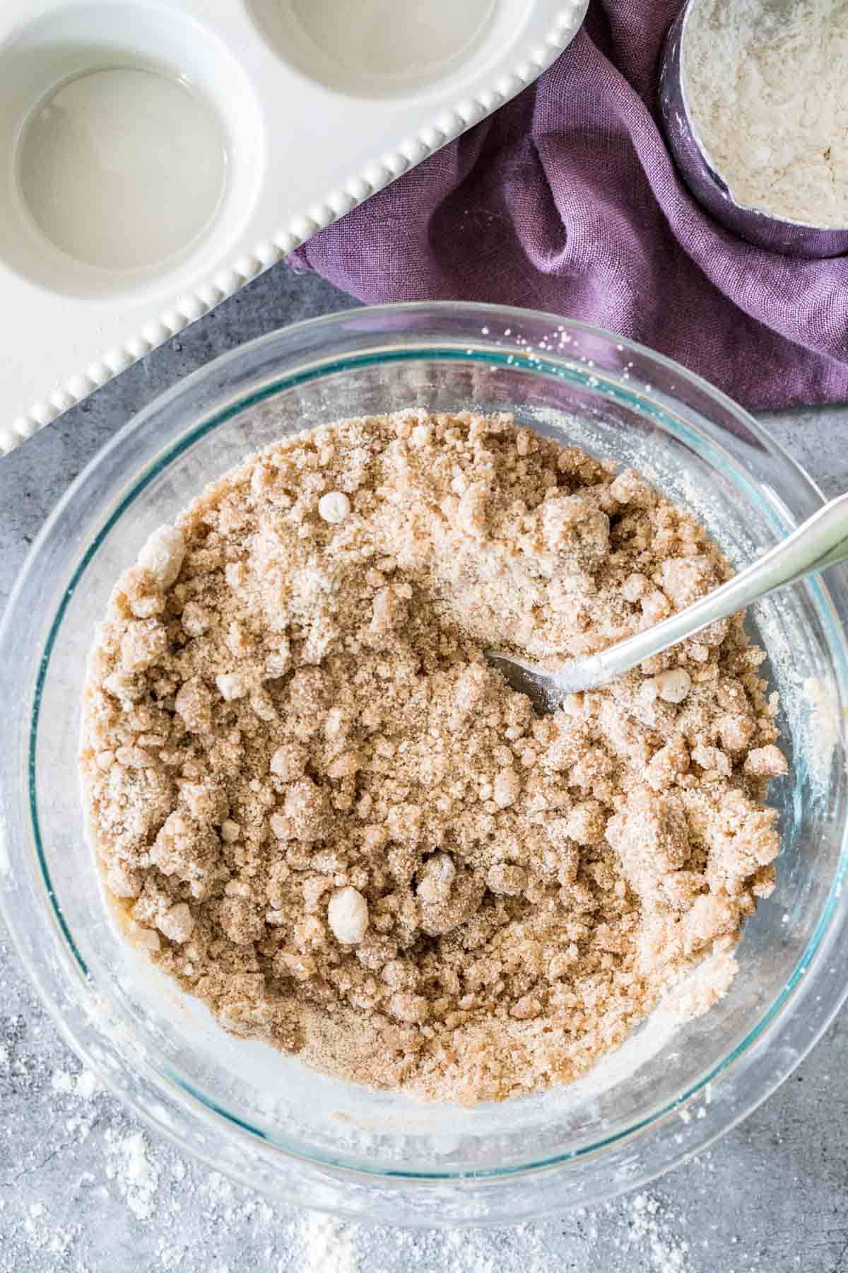 Overhead shot of streusel ingredients being mixed with a fork.