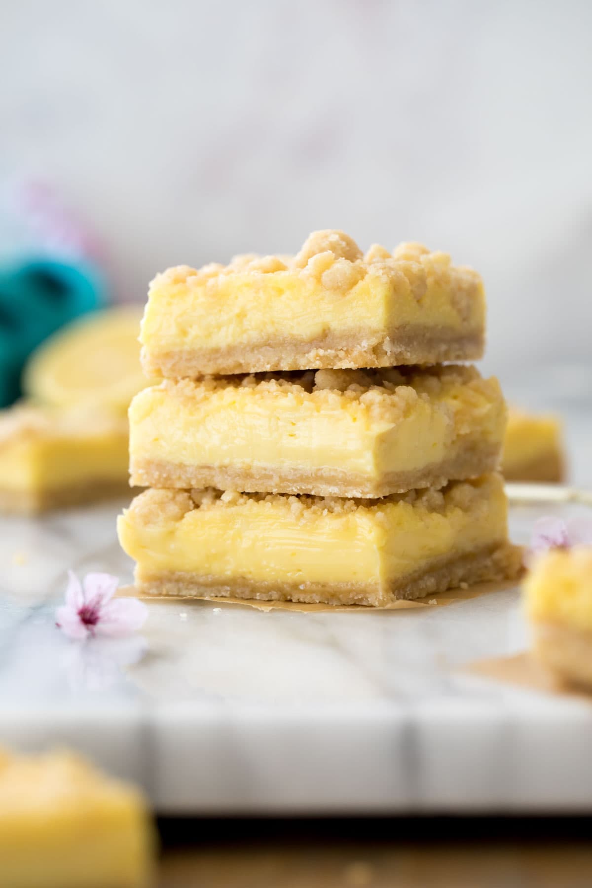 Stack of lemon crumb bars on marble