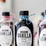 Single image of vanilla extract bottled with teal header bar