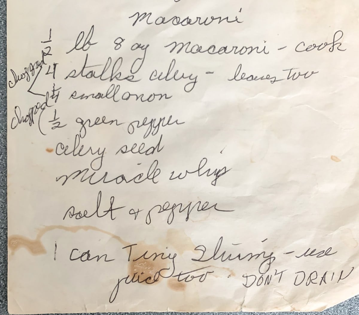 image of a handwritten recipe for macaroni salad on old stained paper