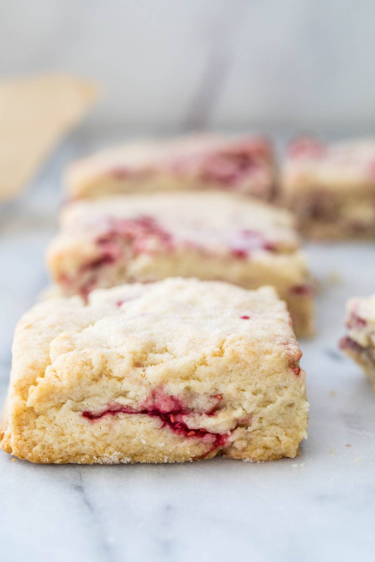 One scone closeup and three others in the background