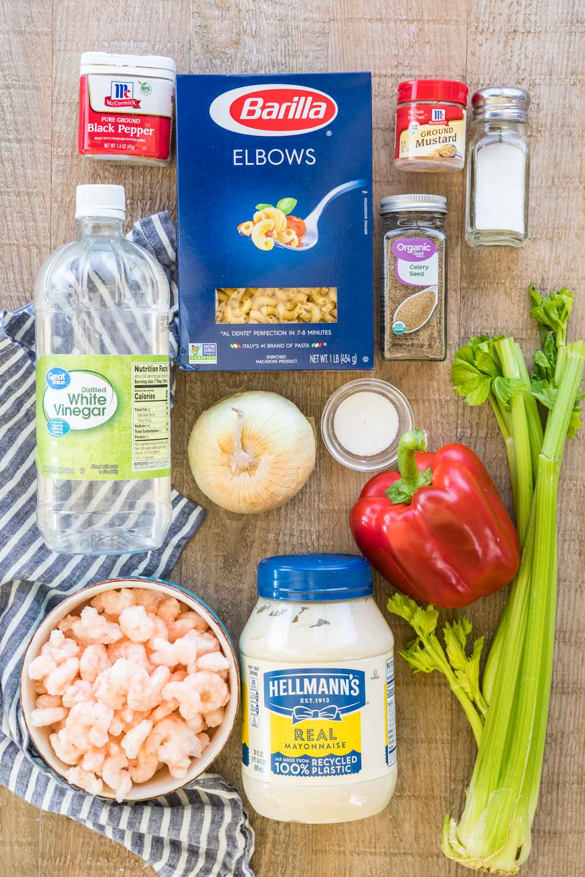 Black pepper, elbow macaroni, ground mustard, salt, celery seed, white vinegar, onion, granulated sugar, red bell pepper, celery, baby shrimp, and mayo.