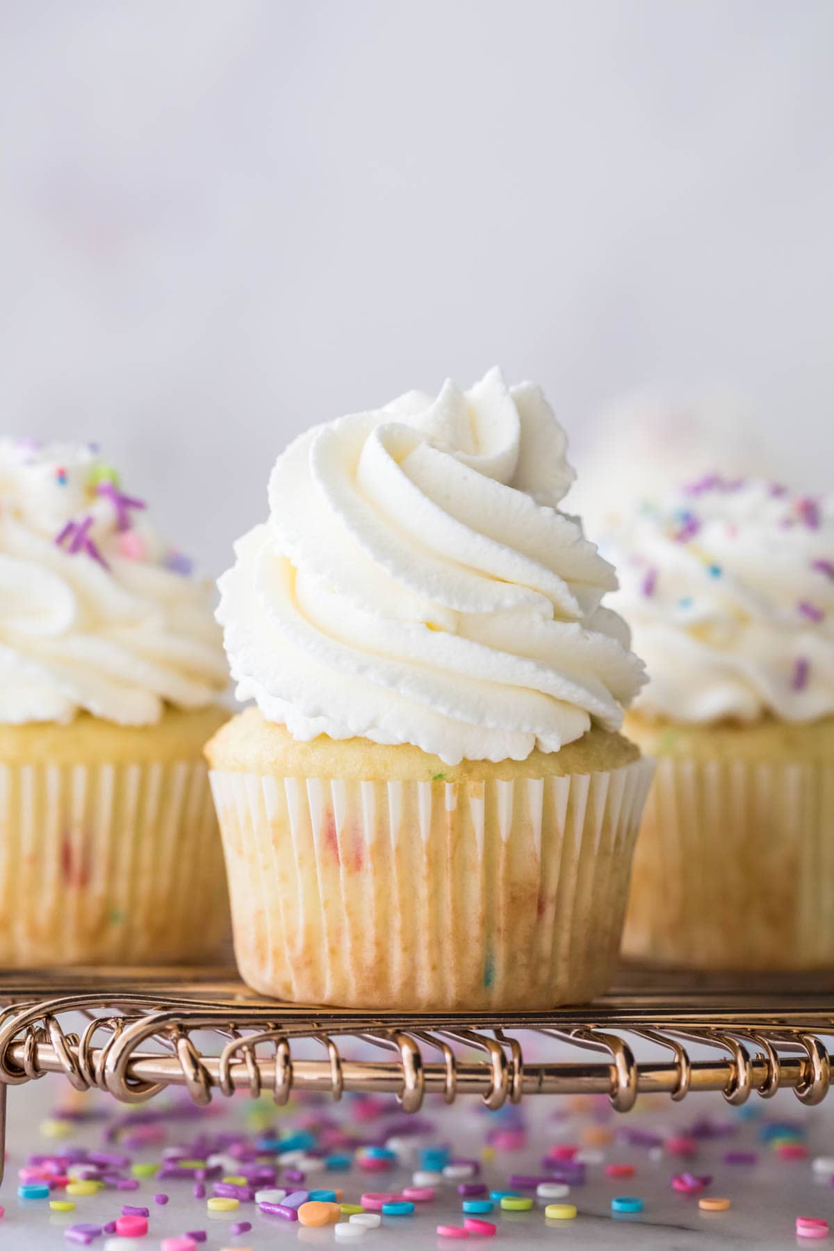 Closeup of cupcake with whipped cream frosting