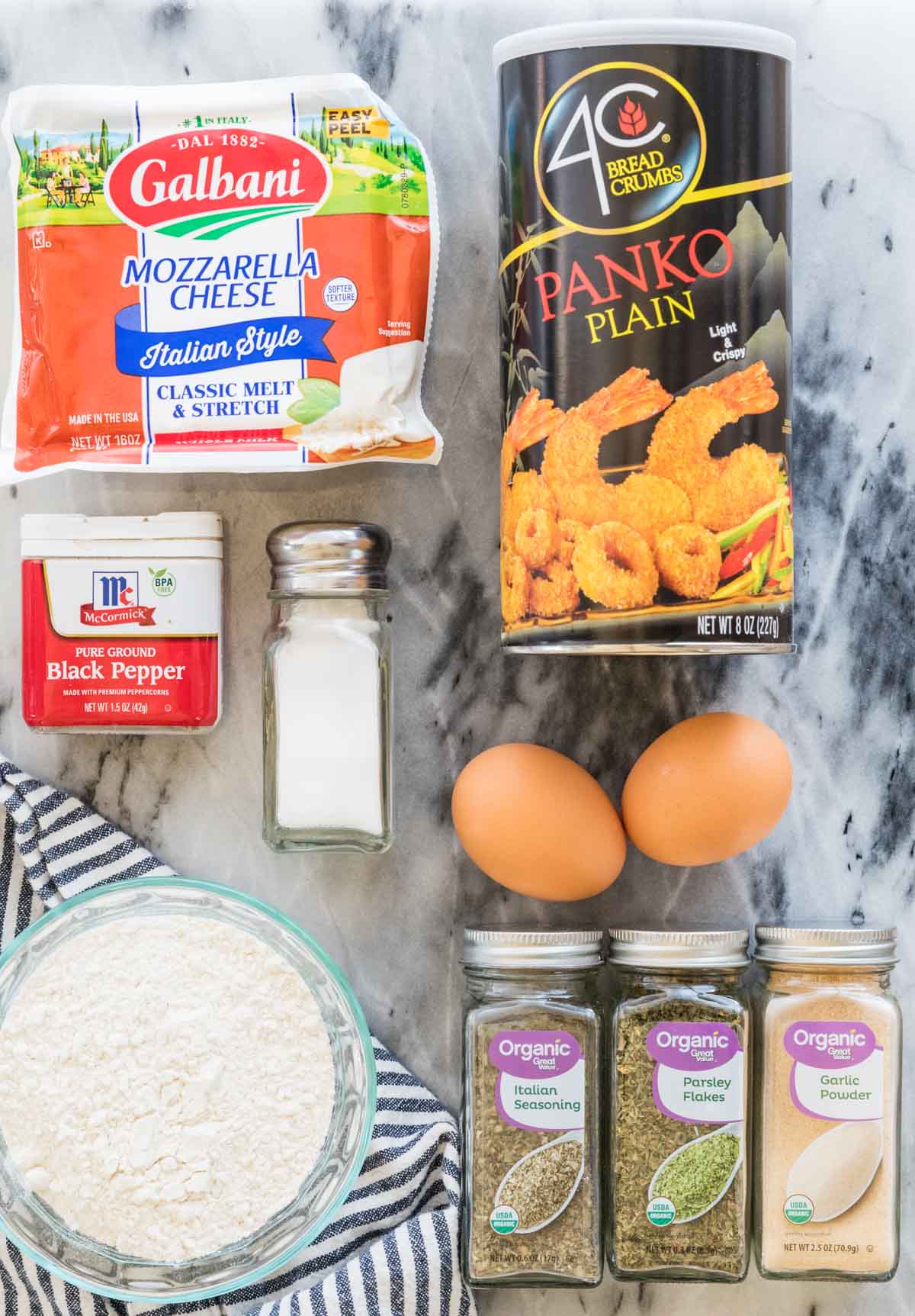 Overhead view of ingredients including panko, mozzarella, eggs, and more.