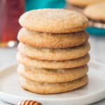stack of honey cookies on a white plate