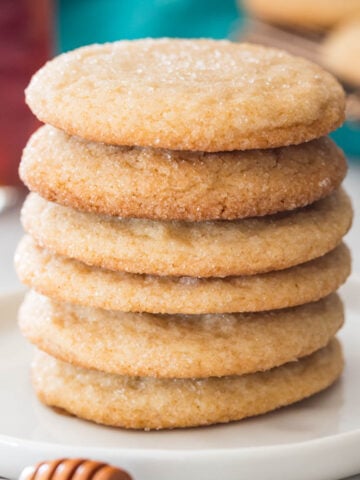 stack of honey cookies on a white plate