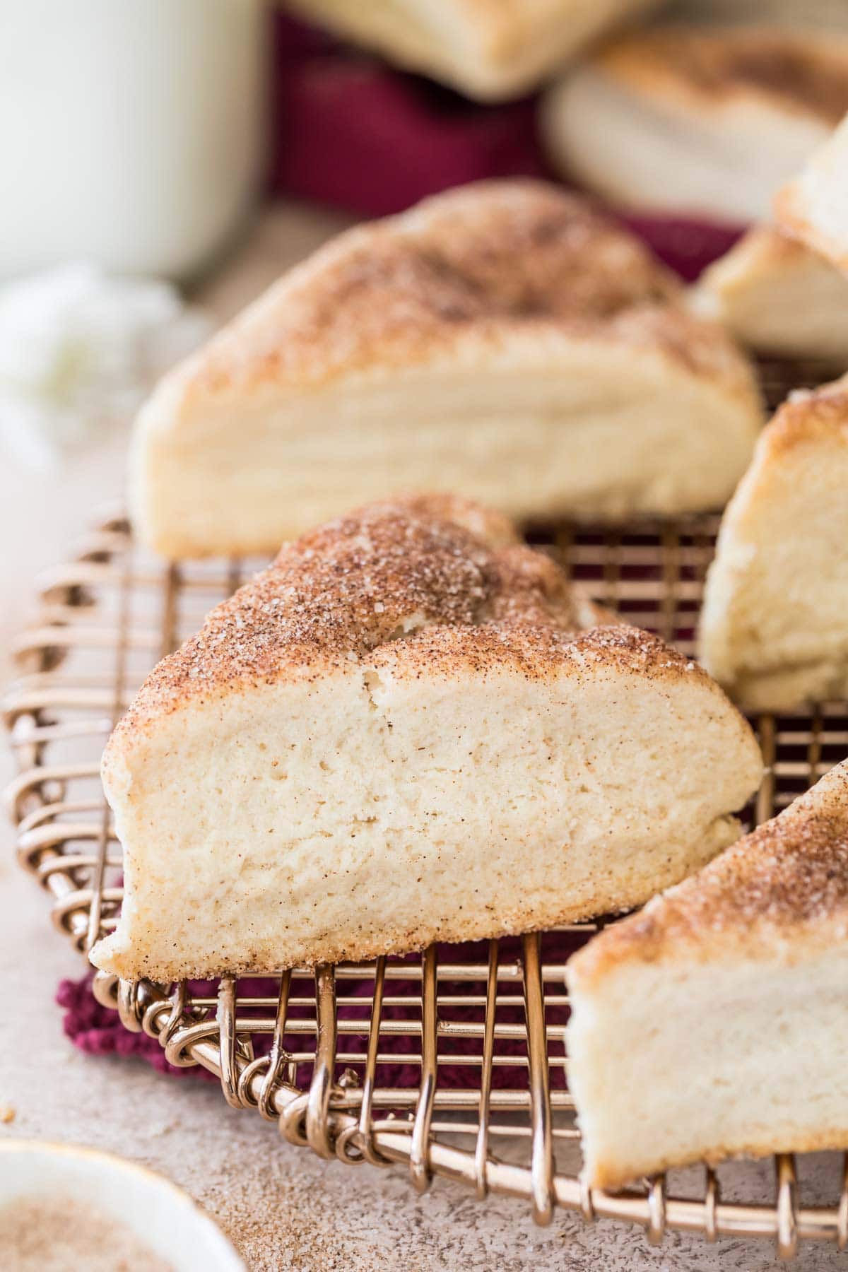 Gold cooling rack topped with snickerdoodle scones