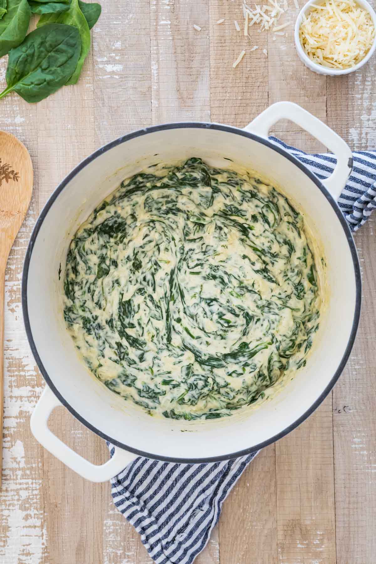 creamed spinach after cooking in enameled white pot