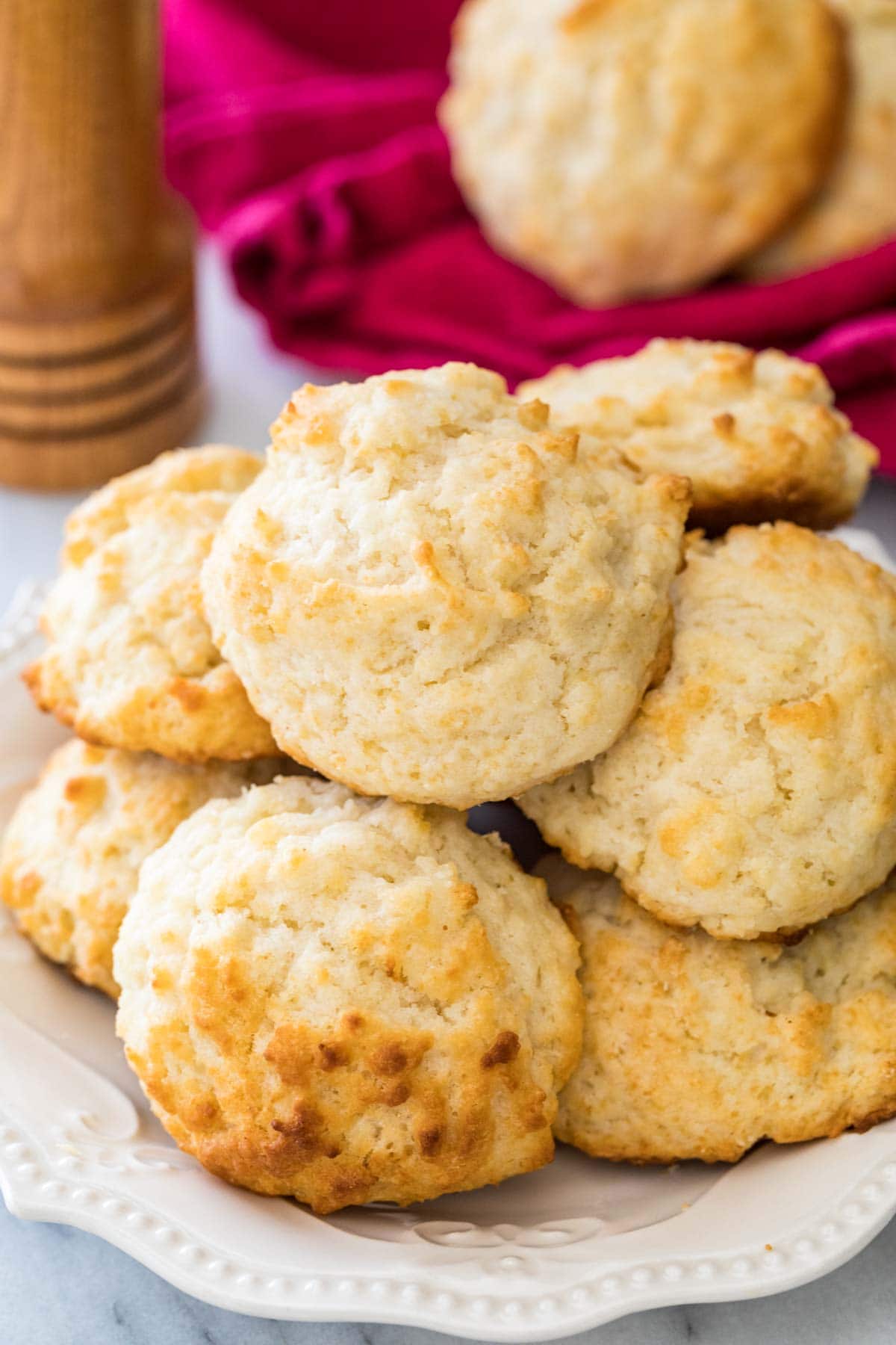 Homemade drop biscuits stacked in a pile