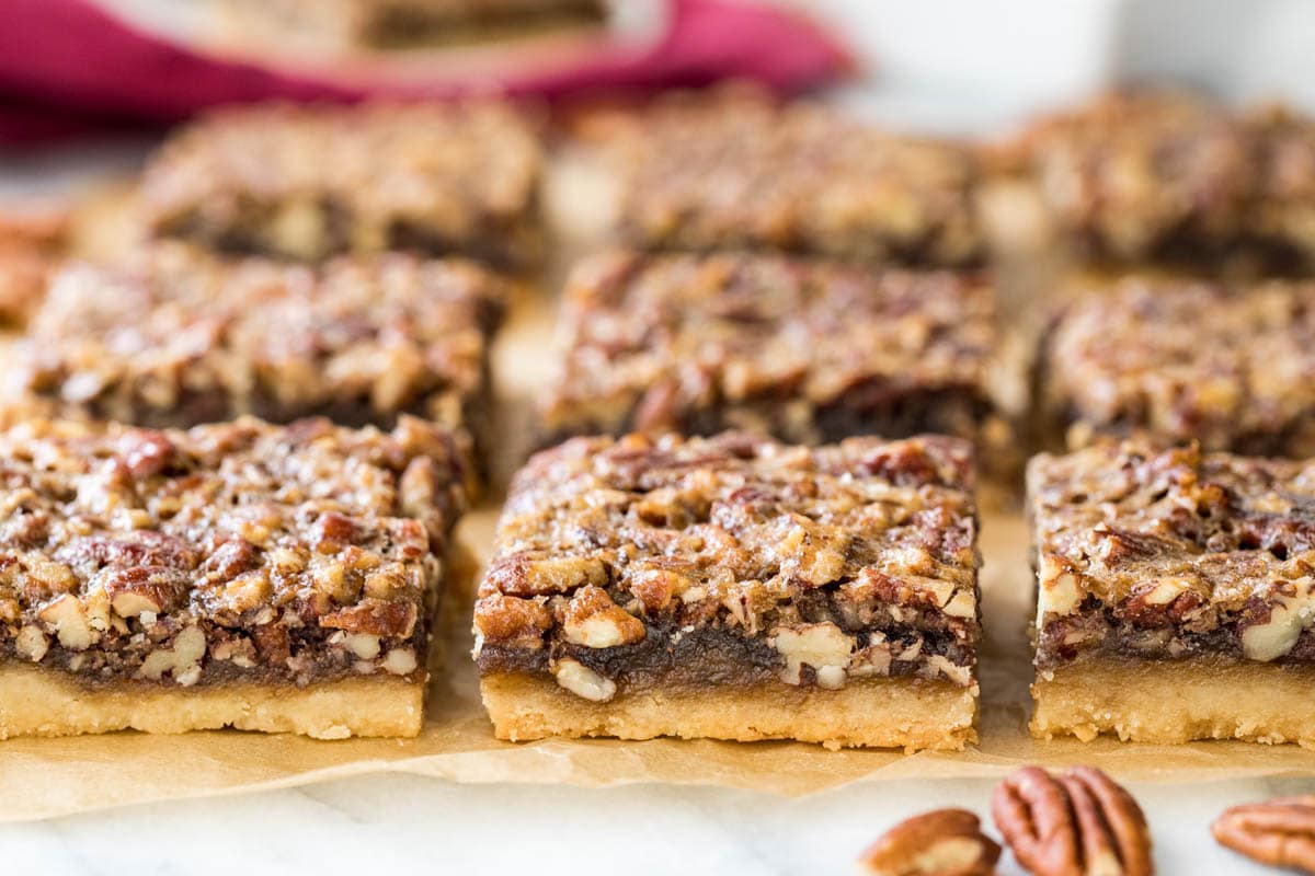 side view of cut pecan pie bars in three neat rows