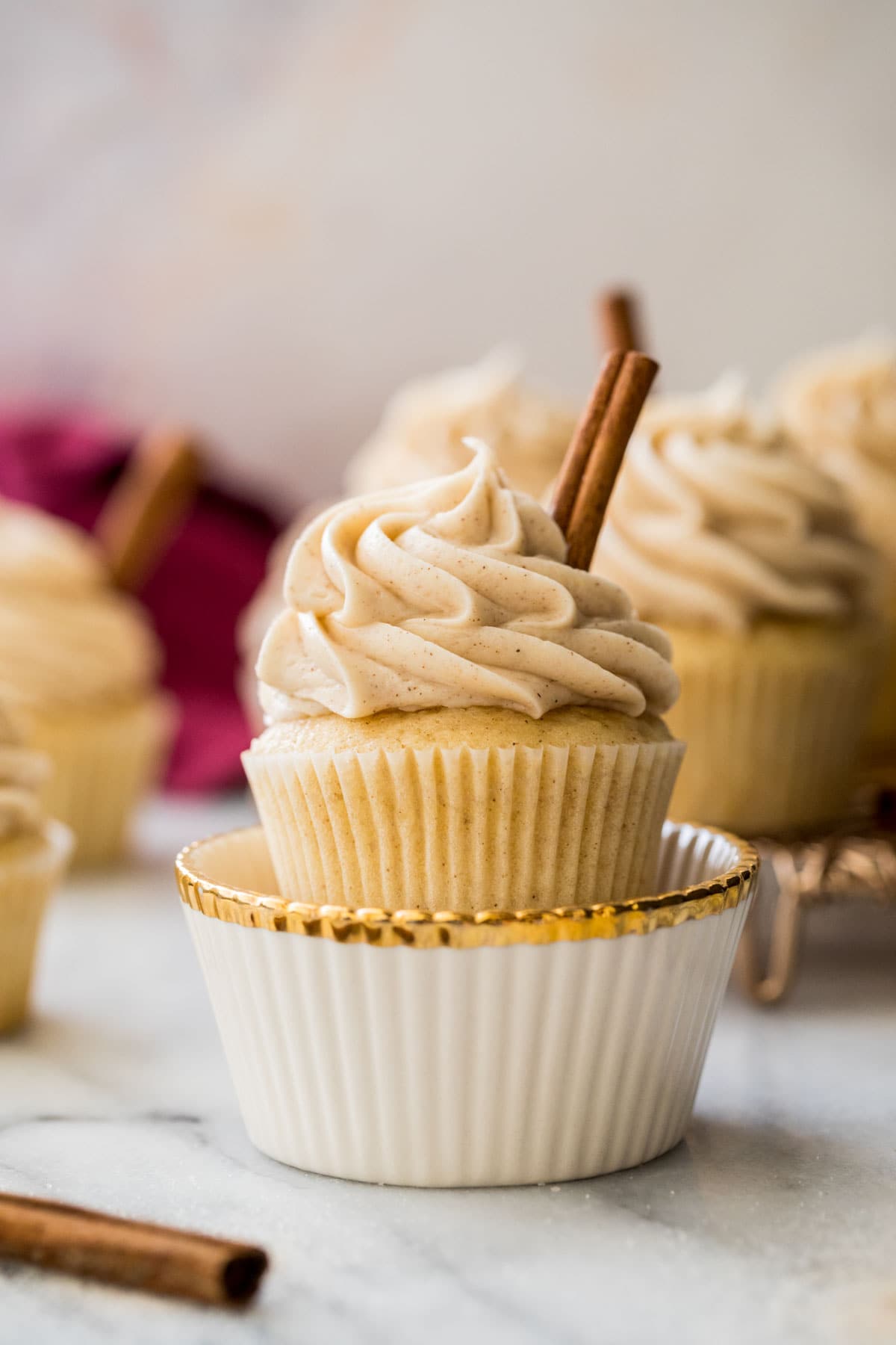 snickerdoodle cupcake in decorative white and gold dish