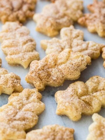 close-up view of leaf shaped pie crust cookies dusted with cinnamon sugar