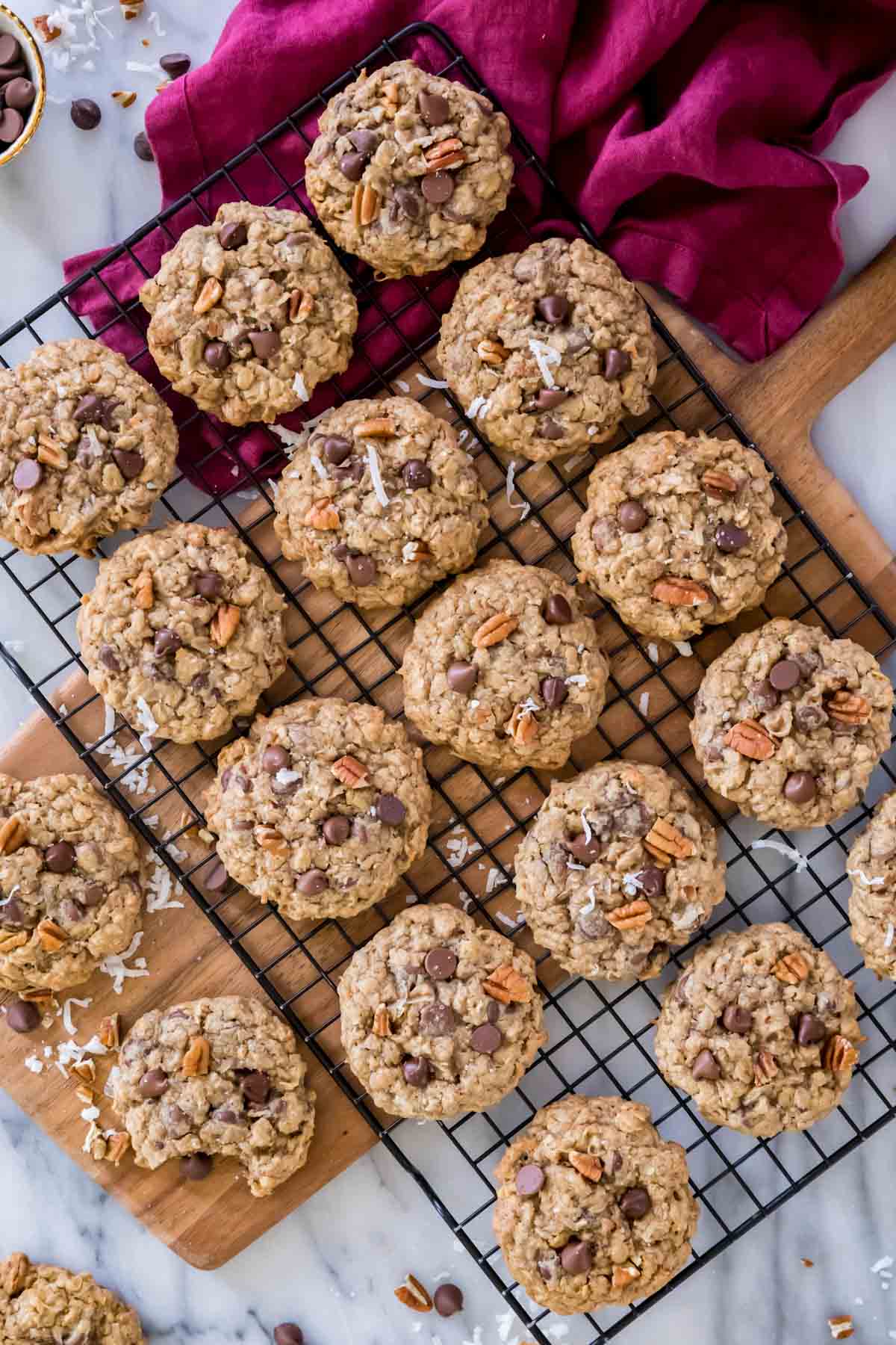 overhead view of neatly arranged cowboy cookies cooling on a metal cooling rack