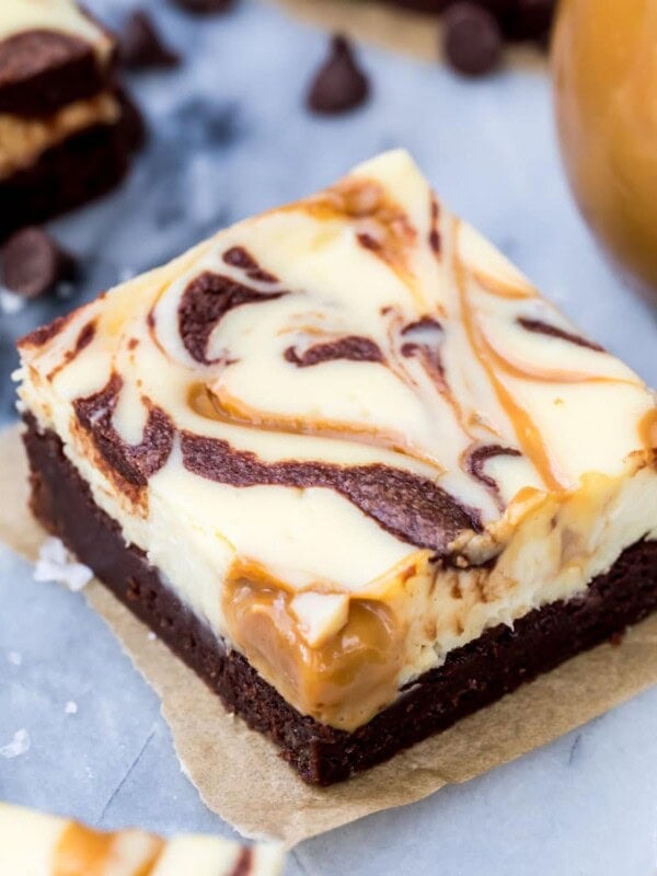Chocolate brownie covered in a cream cheese filling swirled with chocolate and dulce de leche