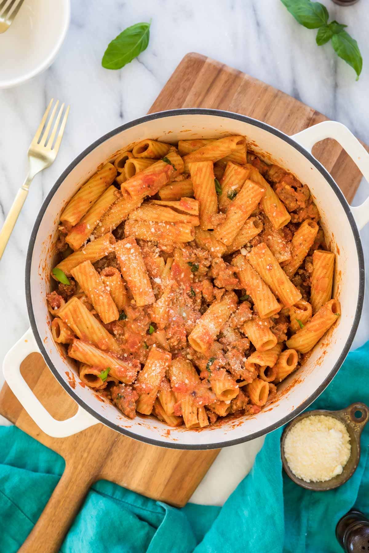 overhead view of a dutch oven filled with rigatoni