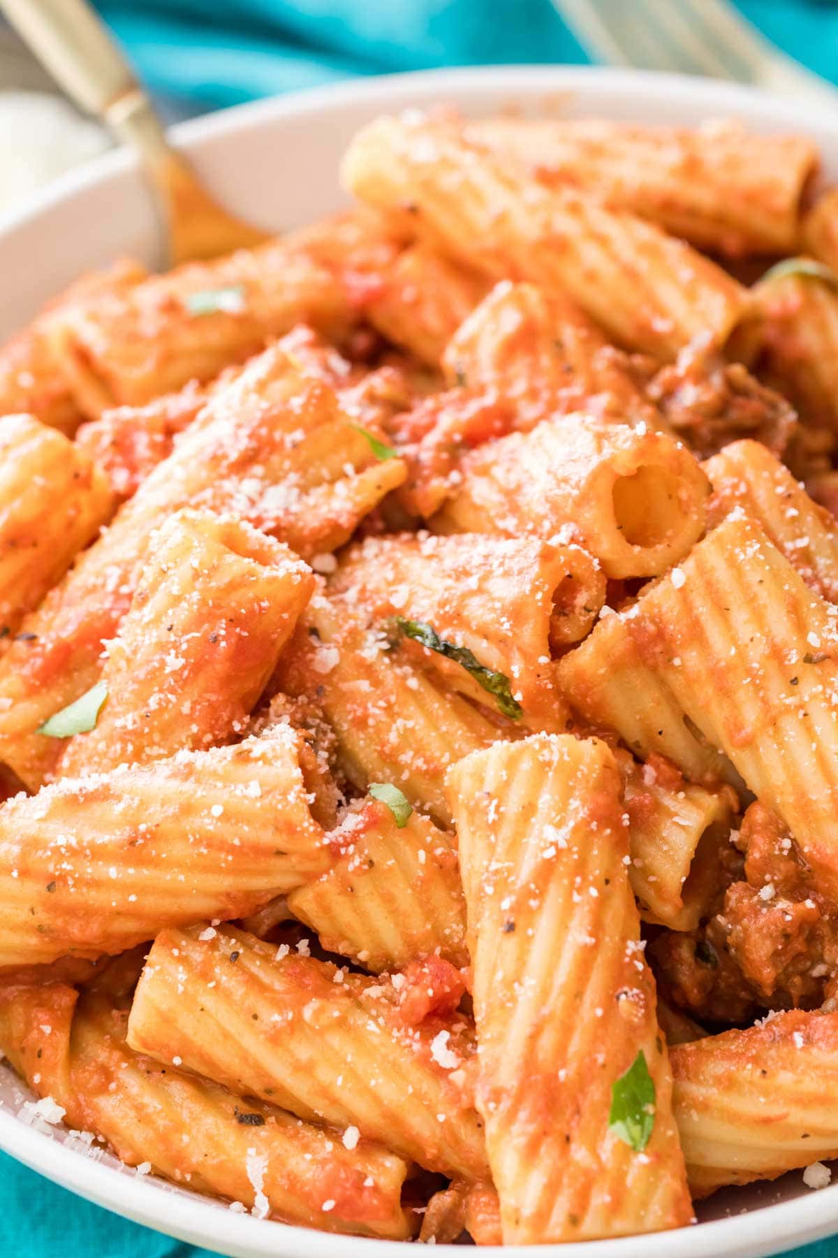 close-up view of rigatoni in large white bowl