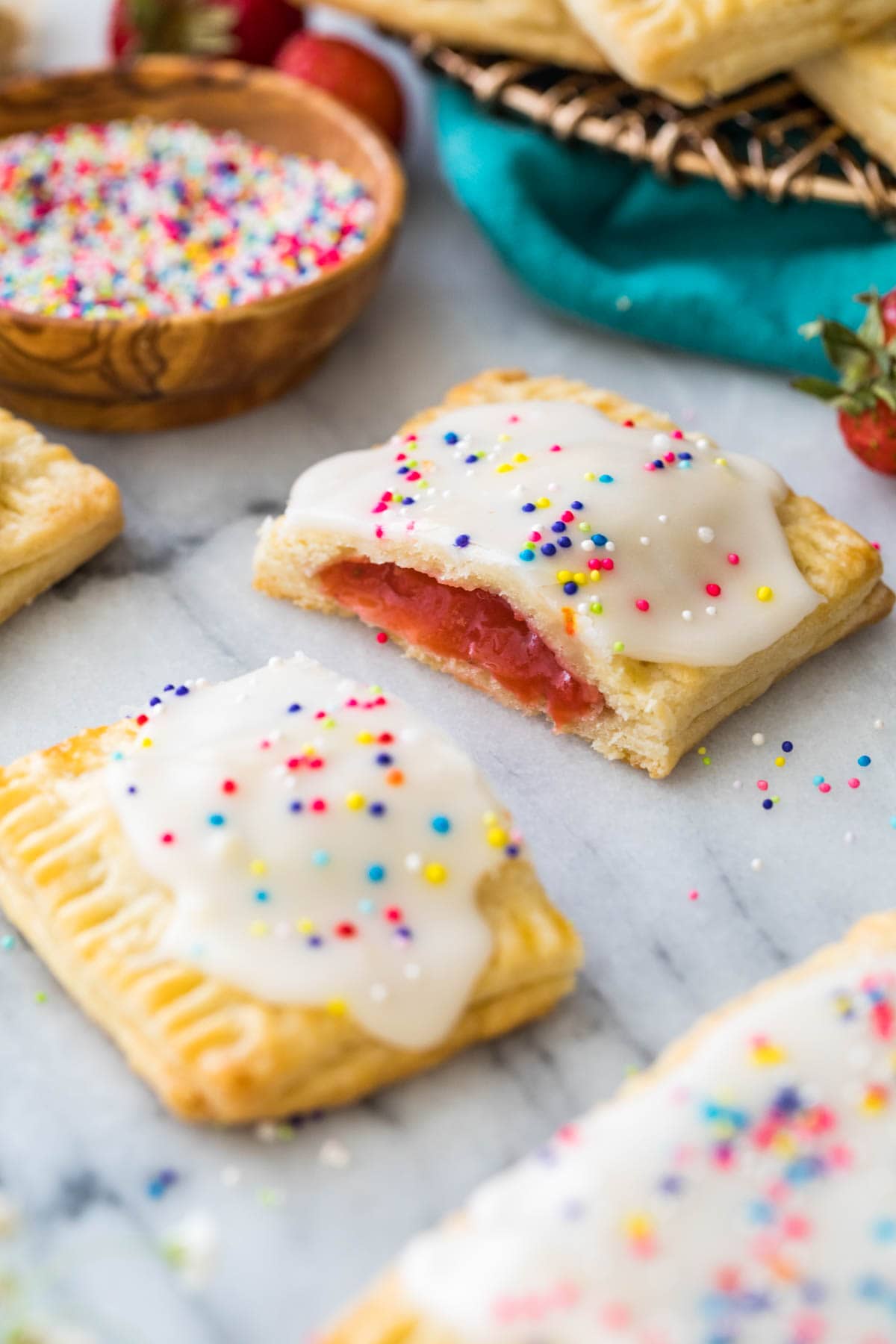 homemade strawberry pop tart broken in half to show strawberry jam filling