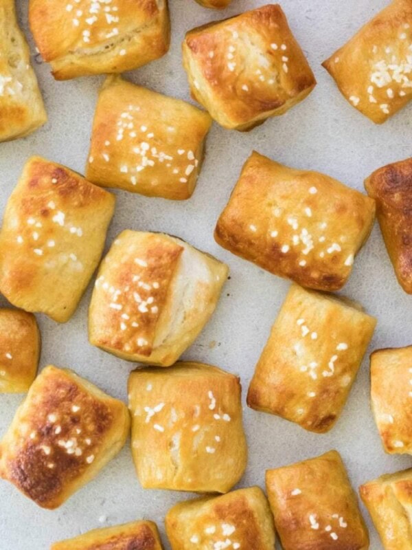 top down view of golden brown homemade soft pretzel bites topped with sallt
