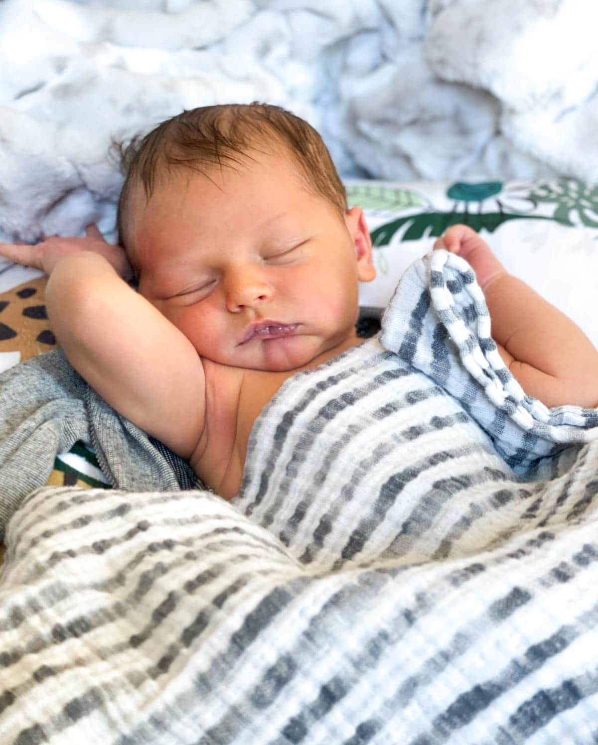 baby boy sleeping in lounger