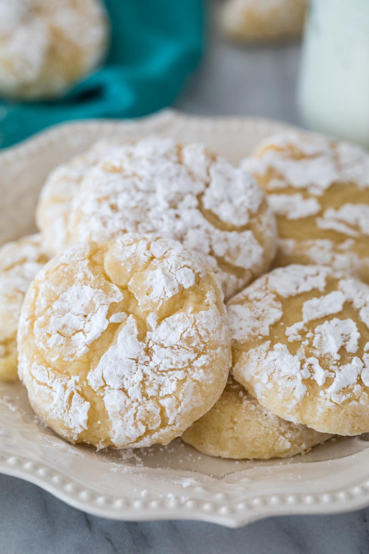 crinkly topped gooey butter cookies on a white plate