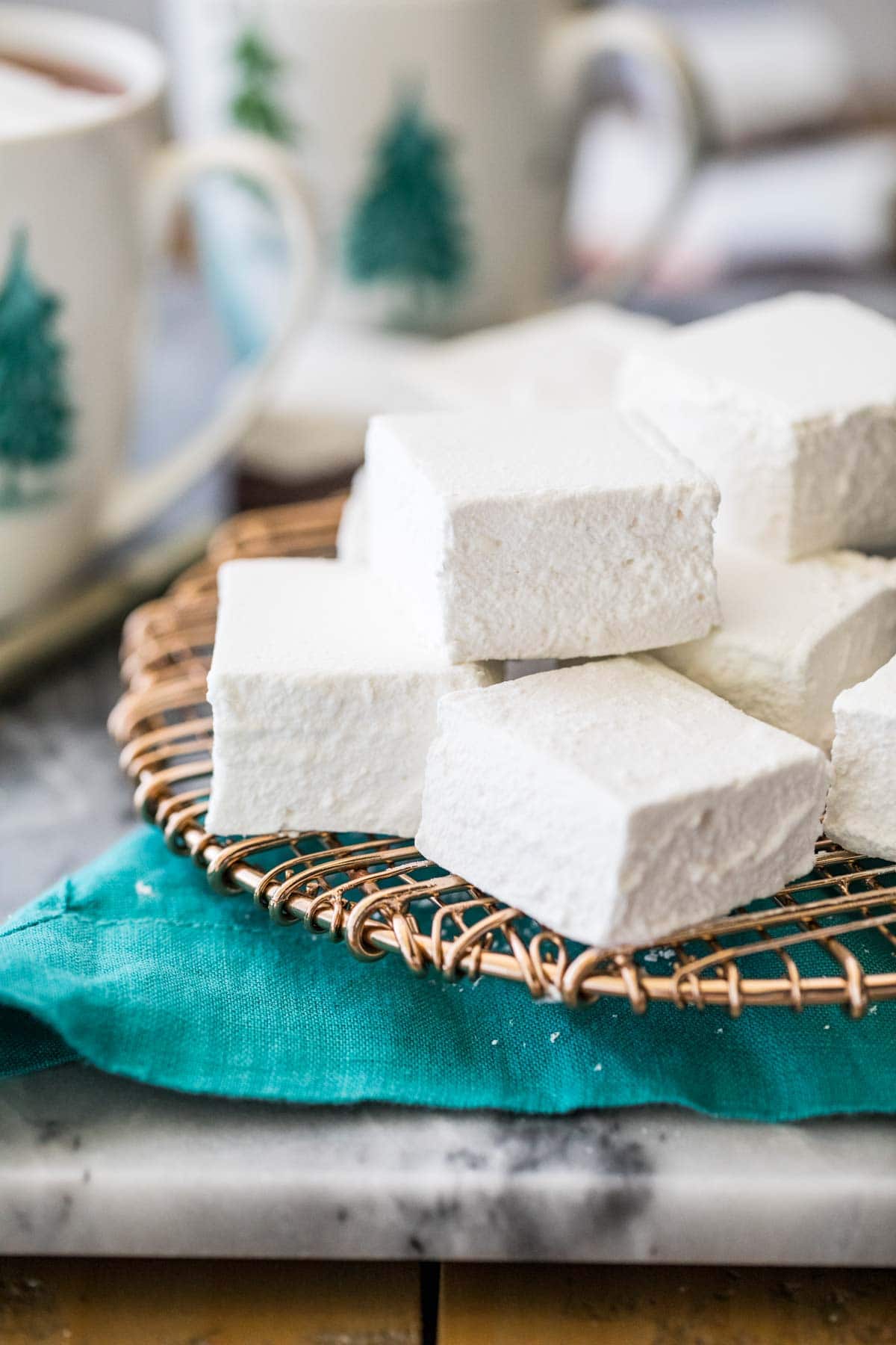 stacked square-shaped homeade marshmallows on a metal cooling rack