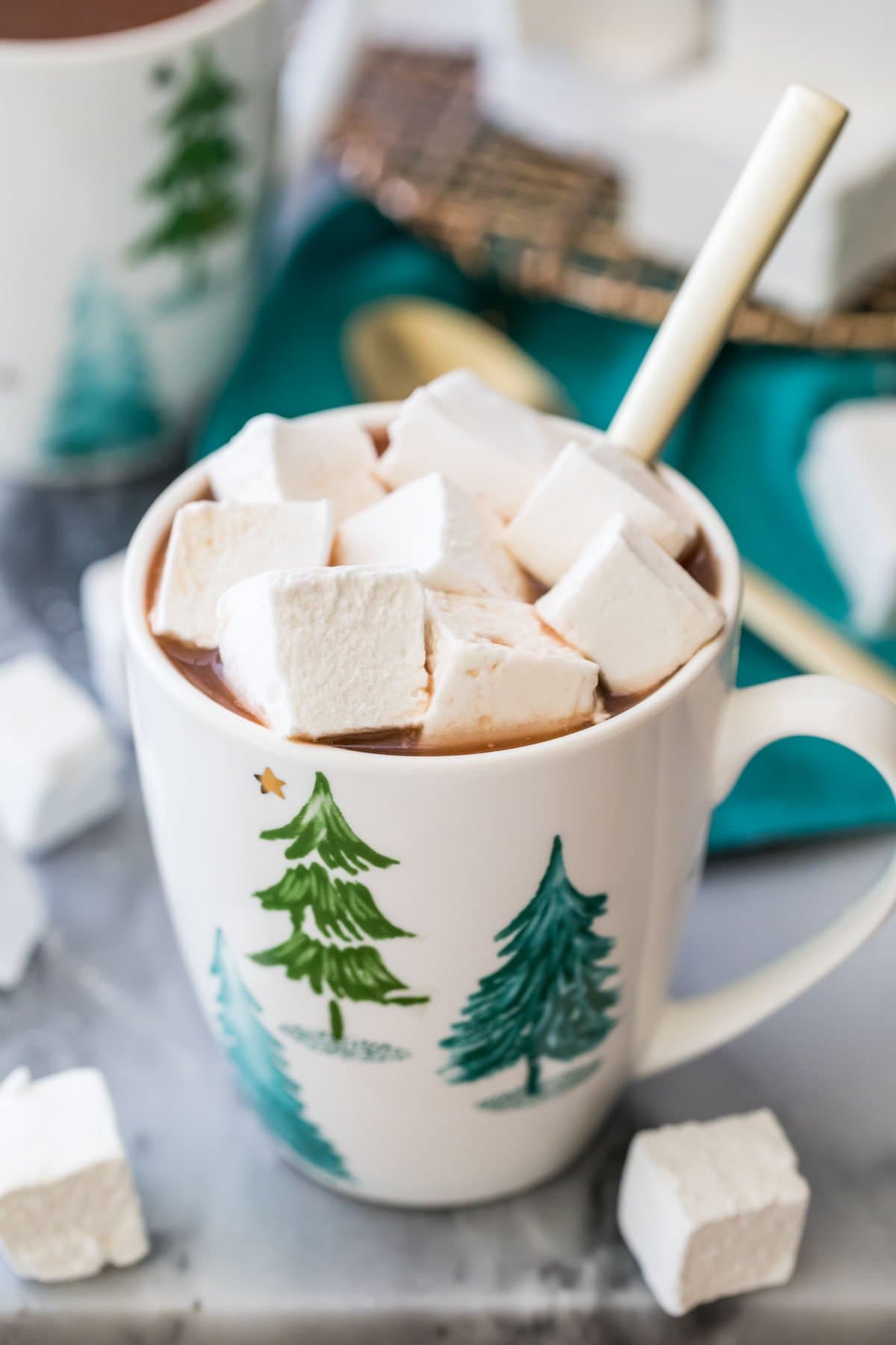cubed homemade marshmallows in a mug of hot chocolate