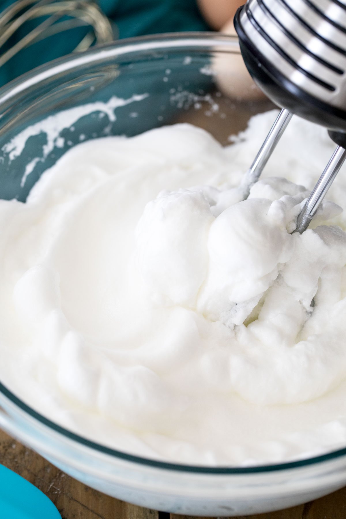 electric mixer beating egg whites to stiff peaks