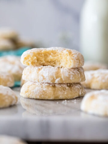 Image of Gooey Butter Cookies stacked, top cookie bite misisng