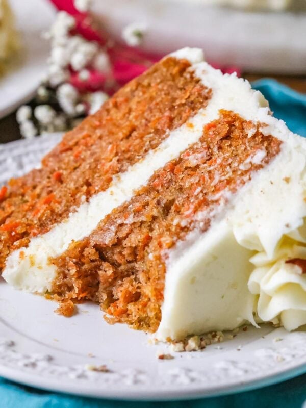 Close-up of a slice of my carrot cake recipe with a bite missing.