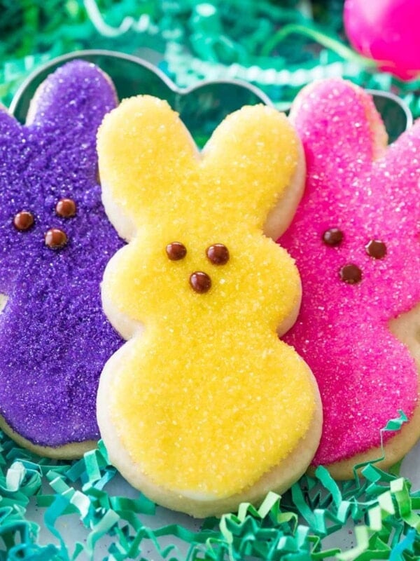 three colorful easter sugar cookies decorated like bunny peeps