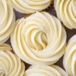 close-up overhead view of cupcakes with piped swirls with lemon frosting