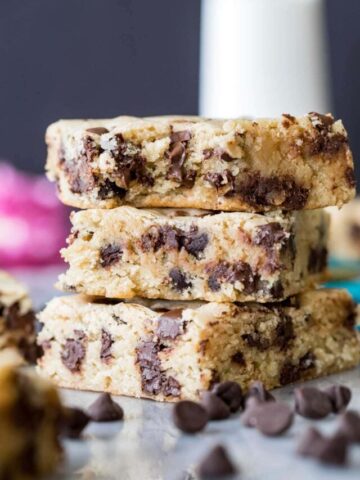 three chocolate chip cookie bars stacked vertically