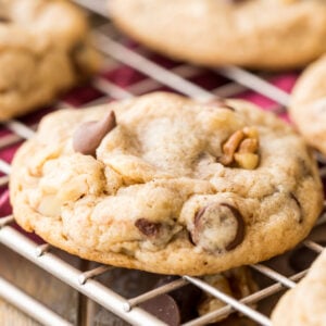 close-up view of a banana cookie studded with chocolate chips and walnuts