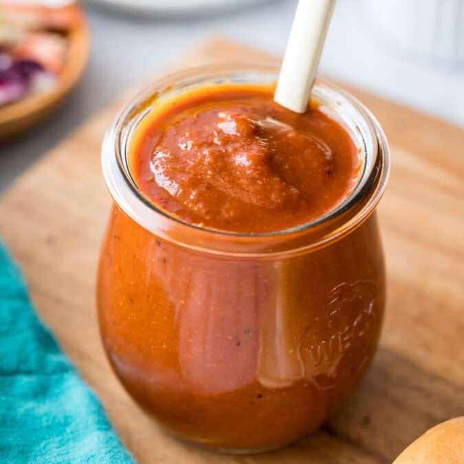 small glass jar of homemade BBQ sauce